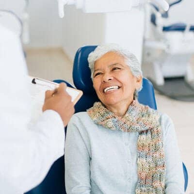 woman getting white dental filling image