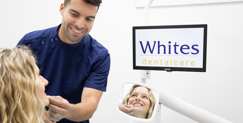 Patient getting dental treatment at whites dental care image